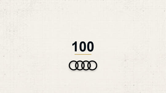 Audi 100 model name with Audi logo on a pale technical background