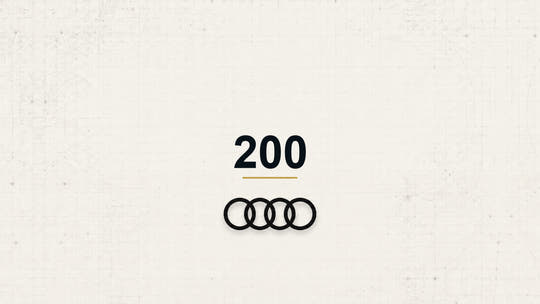 Audi 200 model name with Audi logo on a pale technical background