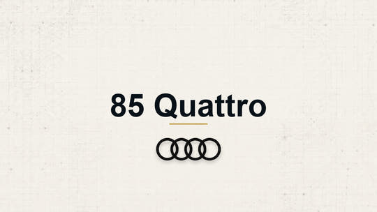 Audi 85 Quattro model name with Audi logo on a pale technical background