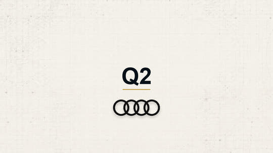 Audi Q2 model name with Audi logo on a pale technical background