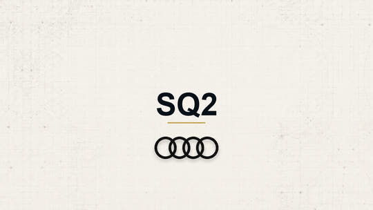 Audi SQ2 model name with Audi logo on a pale technical background
