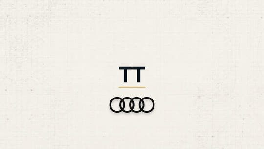 Audi TT model name with Audi logo on a pale technical background