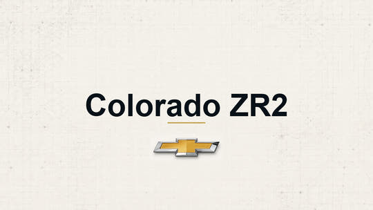 Chevrolet Colorado ZR2 model name with Chevrolet logo on a pale technical background