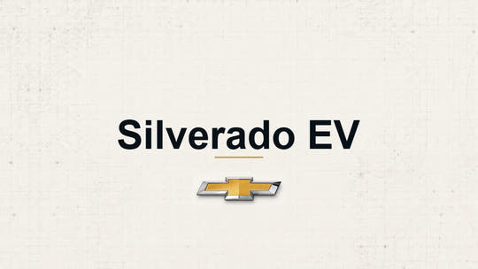 Chevrolet Silverado EV model name with Chevrolet logo on a pale technical background