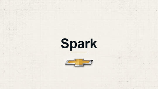 Chevrolet Spark model name with Chevrolet logo on a pale technical background
