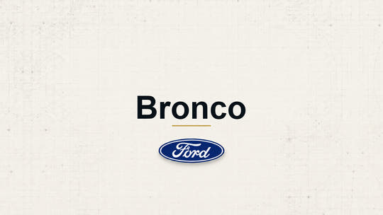 Bronco model name with Ford logo on a pale technical background