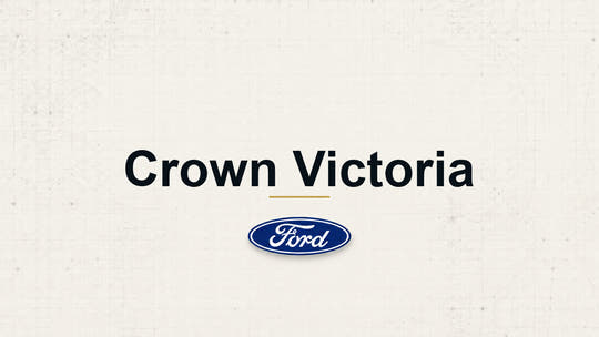 Crown Victoria model name with Ford logo on a pale technical background