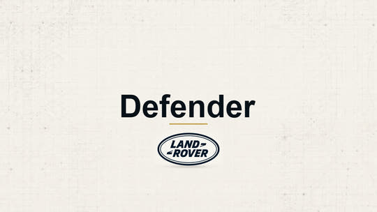 Land Rover Defender model name with Land Rover logo on a pale technical background