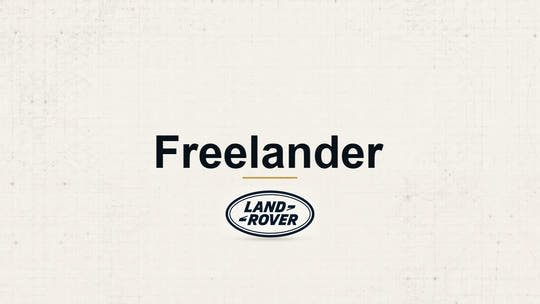 Land Rover Freelander model name with Land Rover logo on a pale technical background