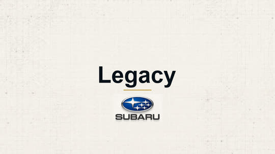Subaru Legacy model name with Subaru logo on a pale technical background