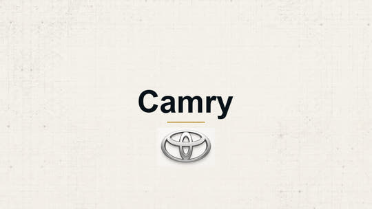 Toyota Camry model name with Toyota logo on a pale technical background