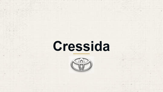 Toyota Cressida model name with Toyota logo on a pale technical background