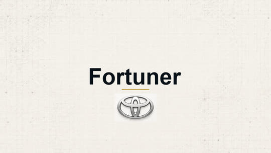 Toyota Fortuner model name with Toyota logo on a pale technical background