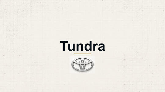 Toyota Tundra model name with Toyota logo on a pale technical background