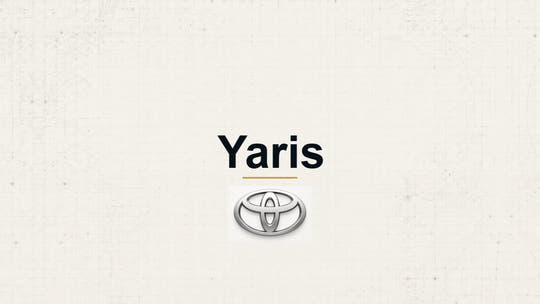 Toyota Yaris model name with Toyota logo on a pale technical background