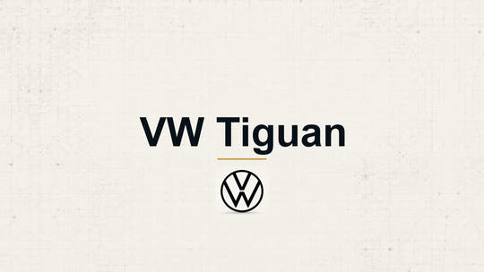 Volkswagen VW Tiguan model name with Volkswagen logo on a pale technical background