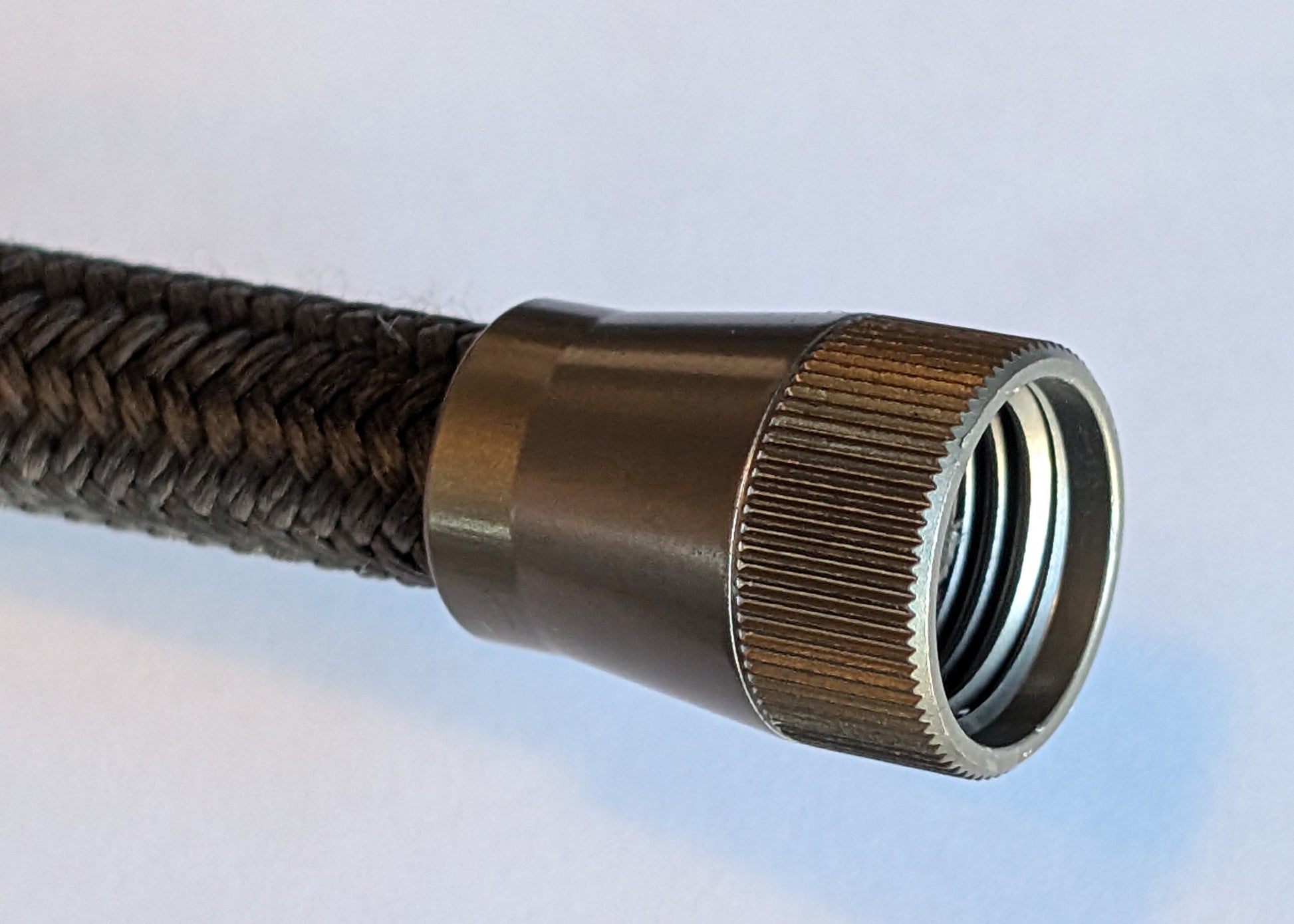 Aluminium cover nut fitted to an APEX 3/8 hose end