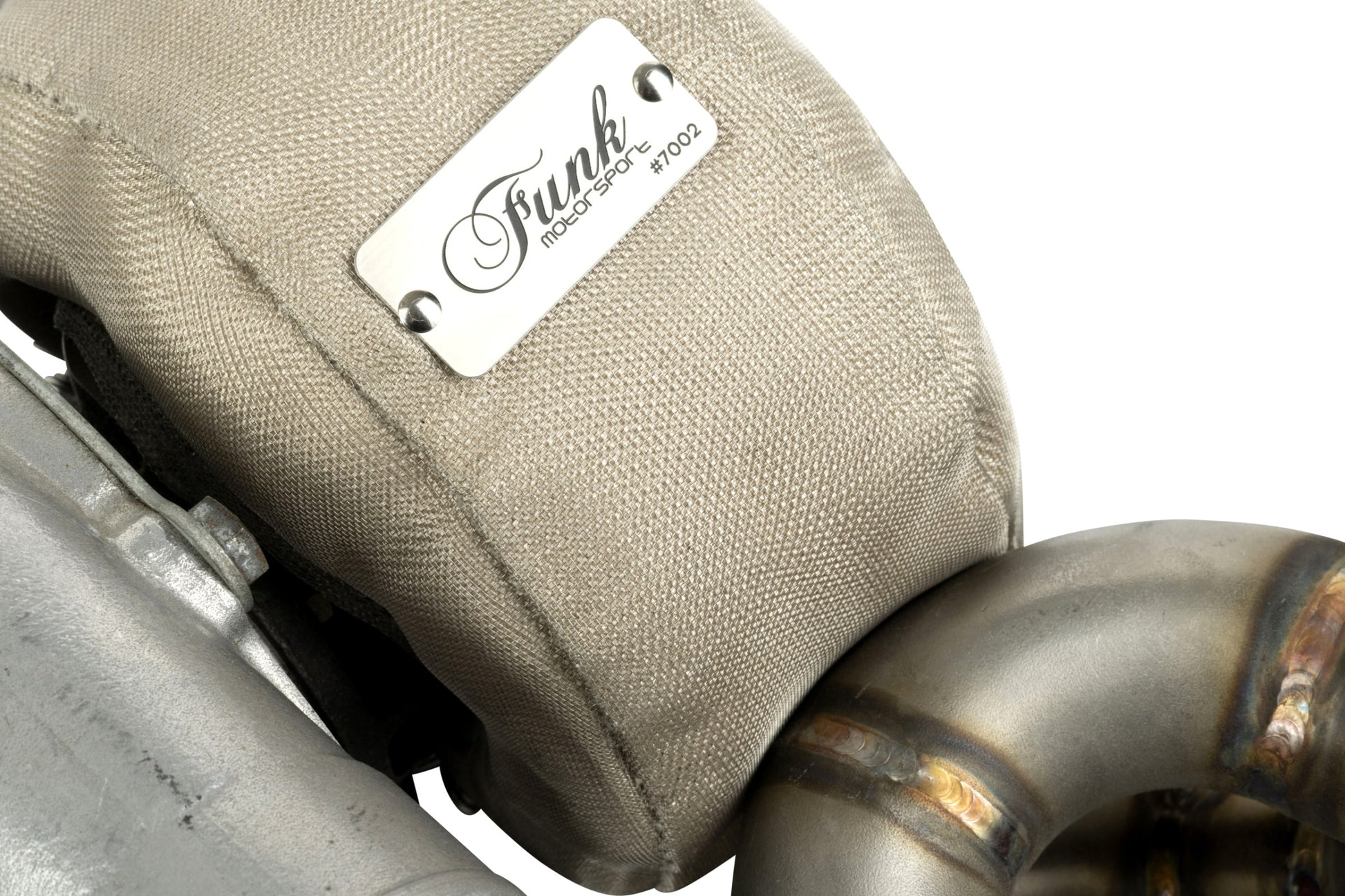 Funk Motorsport turbo blanket fitted to a turbocharger with exhaust pipework alongside