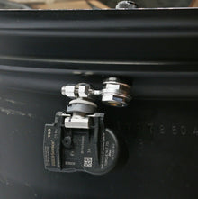 APEX TPMS adapter installed on a wheel